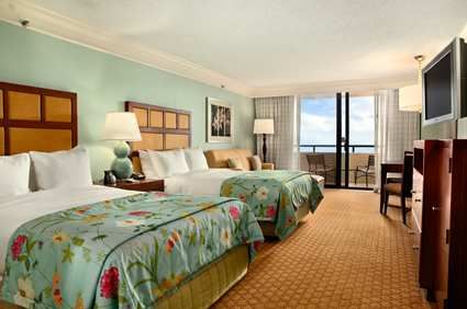 hotel room with double beds, couch and bunk beds